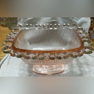 Vintage Indiana glass pink open lace ribbed pedestal candy dish.